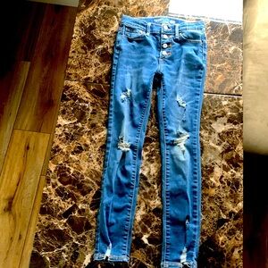 A Old Navy pair of jeans 4 buttons and in the color blue